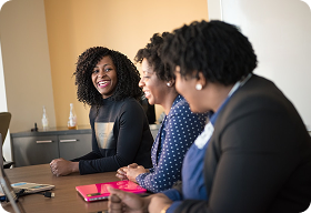 Diverse team of three colleagues in a professional meeting